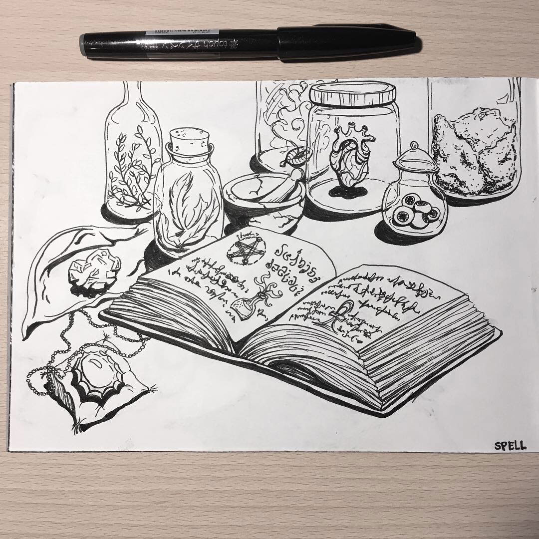 Spellbook with ingredients in jars